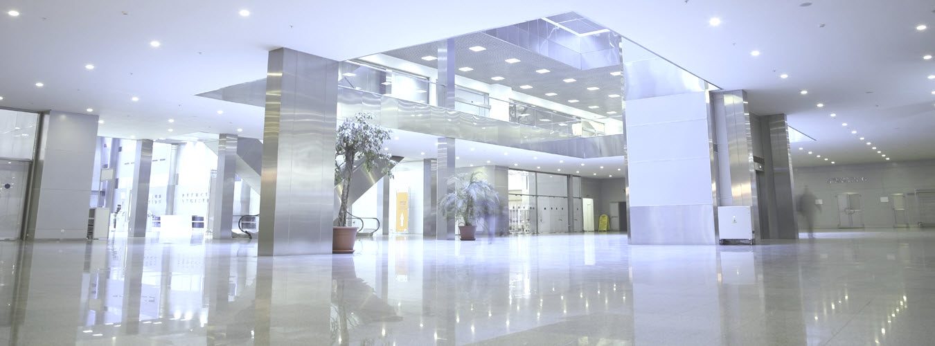 Bright corporate office building entrance with clean and shiny lobby floors